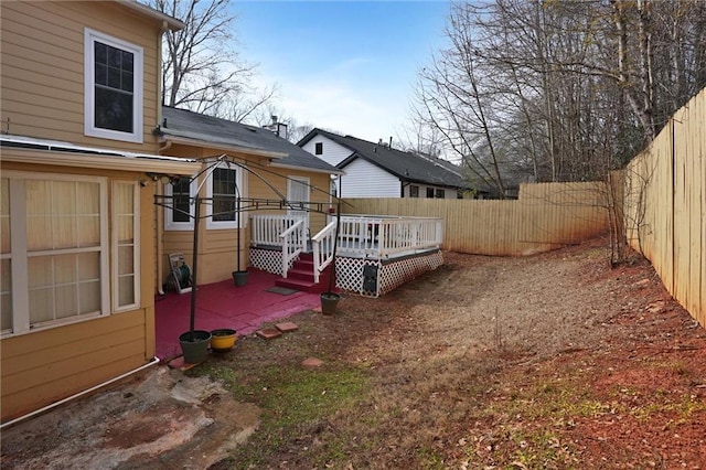 view of yard with a wooden deck