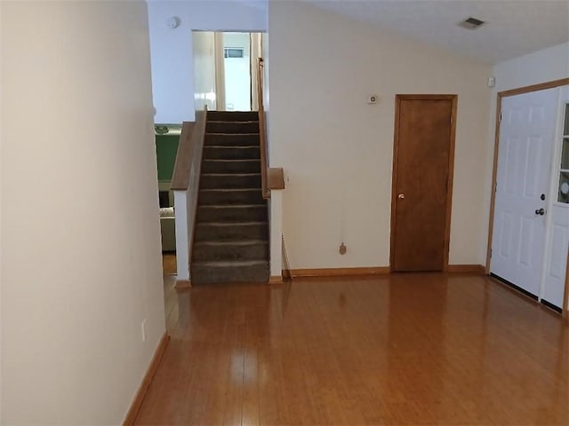 entryway with hardwood / wood-style floors