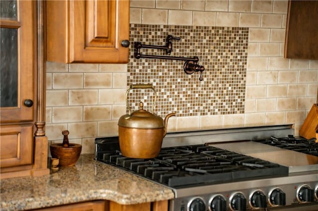 details with tasteful backsplash and light stone countertops