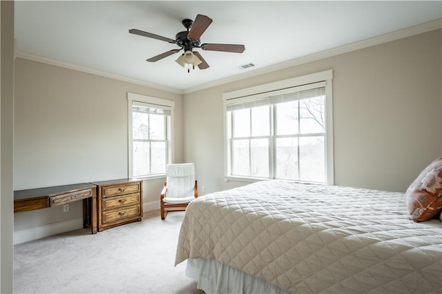 carpeted bedroom with crown molding and ceiling fan