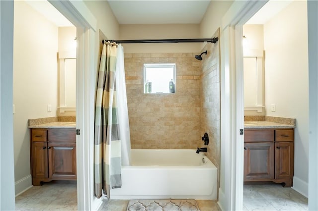 bathroom featuring vanity and shower / bath combo