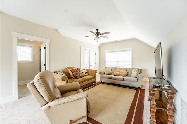 living room featuring vaulted ceiling and ceiling fan