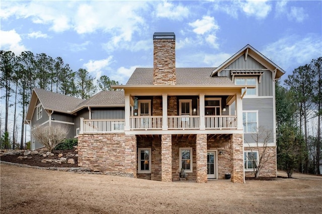 rear view of property with a balcony