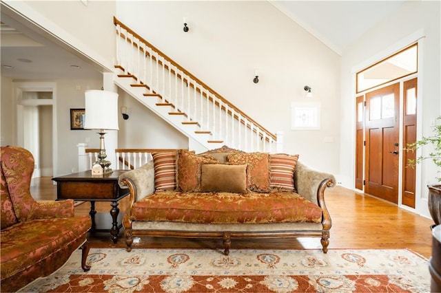 interior space featuring vaulted ceiling and light hardwood / wood-style flooring