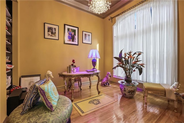 interior space featuring hardwood / wood-style flooring, ornamental molding, and a chandelier