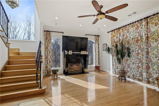 interior space featuring light hardwood / wood-style flooring and ceiling fan