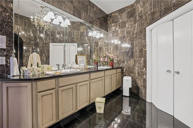 bathroom with tile patterned flooring, vanity, tile walls, and toilet