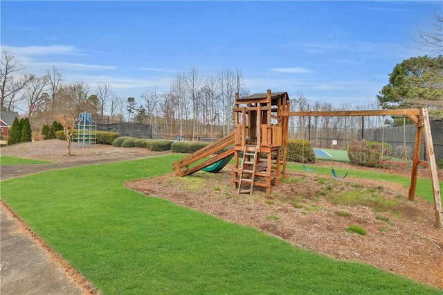 view of jungle gym with a lawn