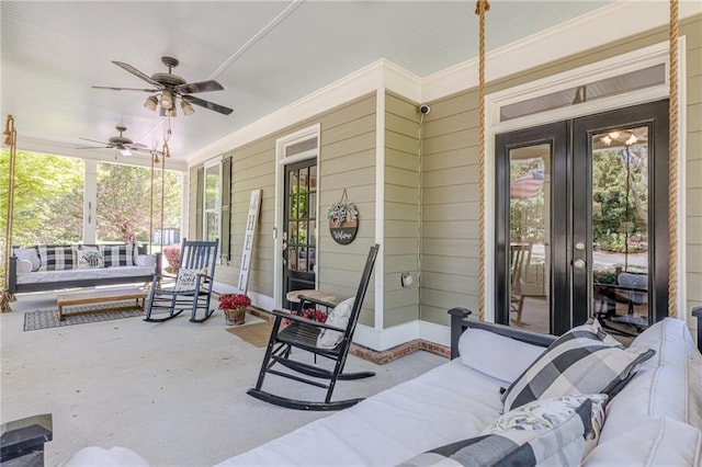 view of patio / terrace with french doors, covered porch, and a ceiling fan