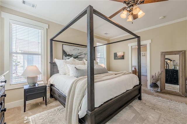 bedroom featuring carpet, visible vents, baseboards, and crown molding