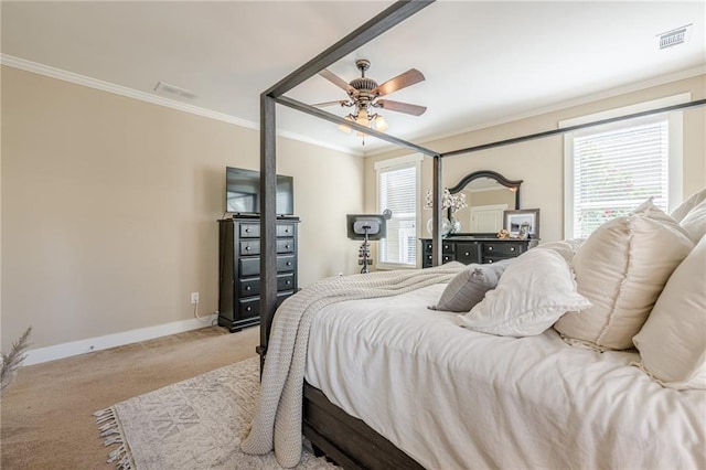 carpeted bedroom featuring crown molding, baseboards, and visible vents