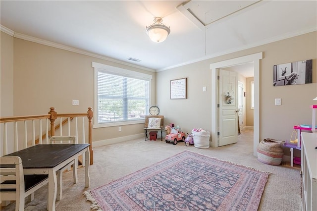 recreation room featuring crown molding, attic access, carpet flooring, and visible vents