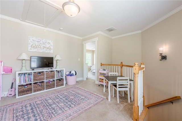 recreation room with visible vents, baseboards, ornamental molding, carpet floors, and attic access