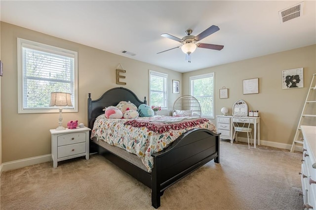 bedroom with light colored carpet, baseboards, and visible vents