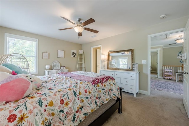 bedroom with light colored carpet, baseboards, a ceiling fan, and visible vents