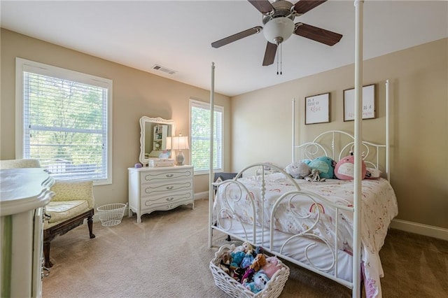 bedroom featuring carpet floors, baseboards, ceiling fan, and visible vents