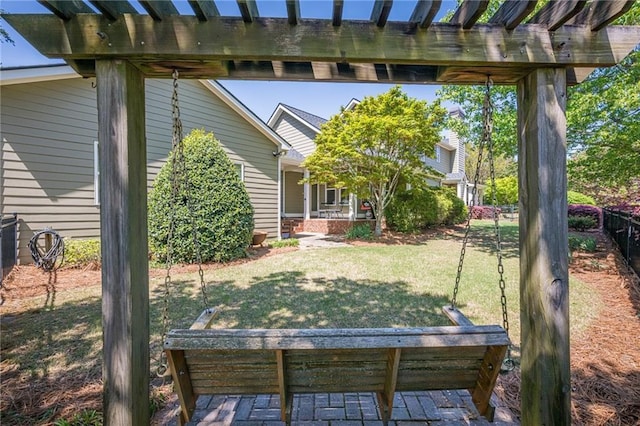 view of yard with a porch, a pergola, and fence