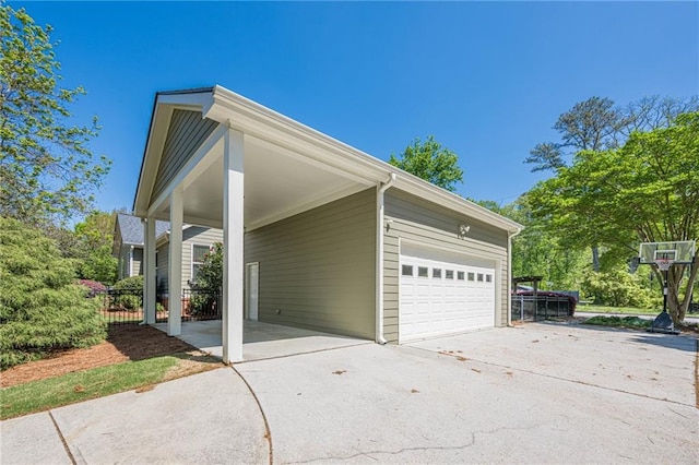 exterior space with concrete driveway