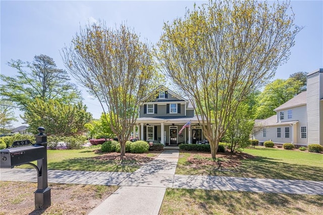 view of front of home with a front lawn and covered porch