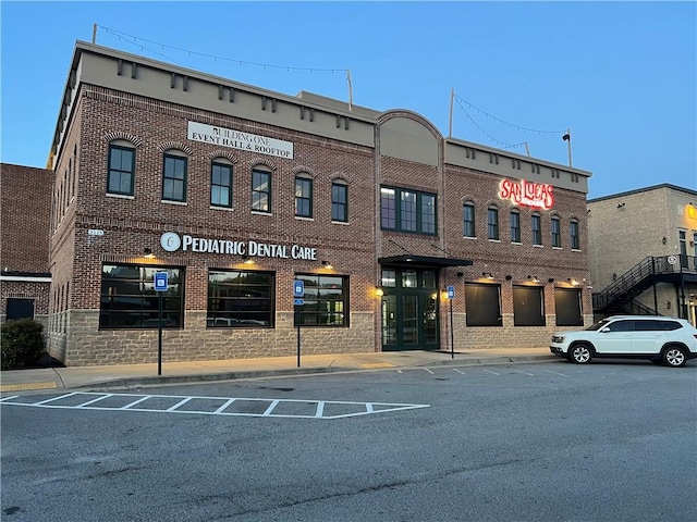 view of property with uncovered parking