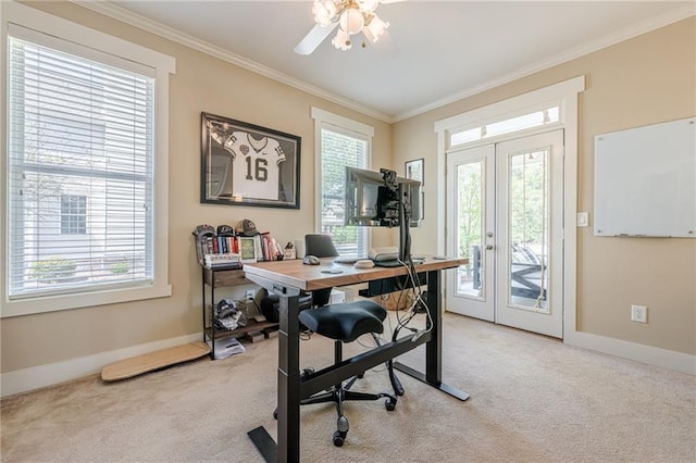 office space with light carpet, french doors, ornamental molding, and a healthy amount of sunlight