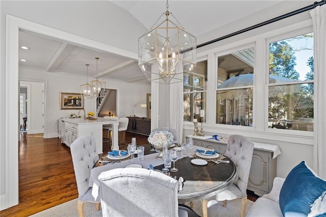 dining room featuring beam ceiling and dark wood-type flooring