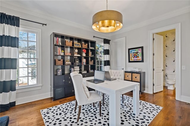 home office featuring hardwood / wood-style flooring and ornamental molding