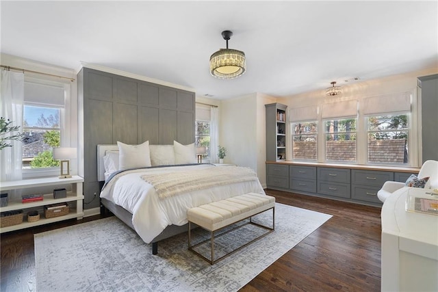 bedroom with dark wood-type flooring