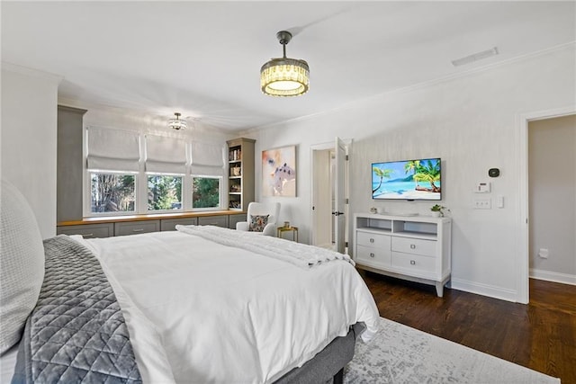 bedroom with crown molding and dark wood-type flooring