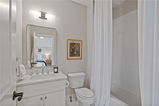 full bathroom with shower / tub combo, vanity, and toilet