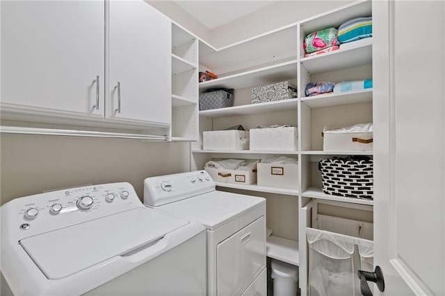 washroom with washing machine and clothes dryer