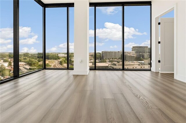 interior space with wood-type flooring and expansive windows