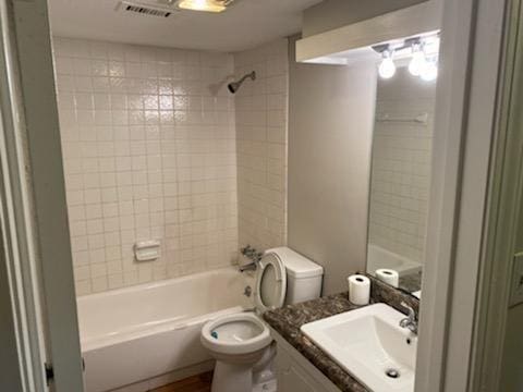 172 Rue Fontaine, Lithonia, GA 30038 - bathroom with vanity, toilet, and shower / tub combination