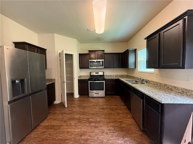 837 Castilla Way, Winder, GA 30680 - kitchen with appliances with stainless steel finishes, dark wood-style floors, and dark brown cabinets