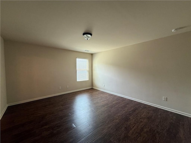 837 Castilla Way, Winder, GA 30680 - spare room with baseboards and dark wood-style flooring