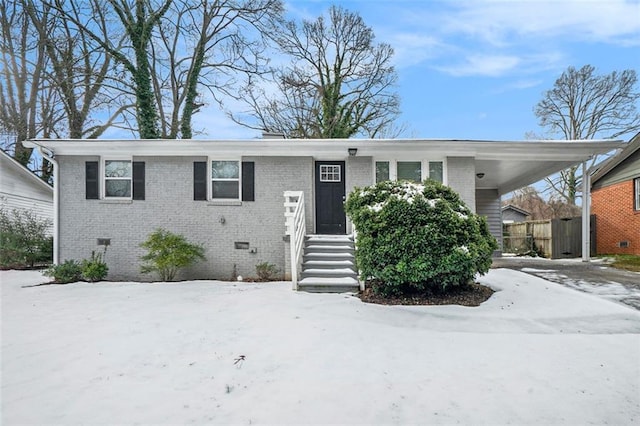 view of front of home featuring a carport