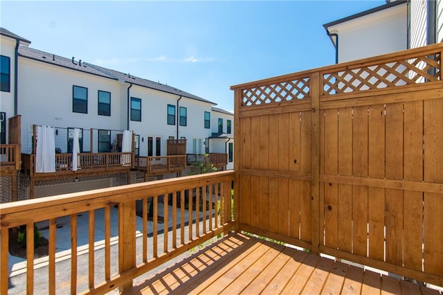 wooden terrace featuring a residential view