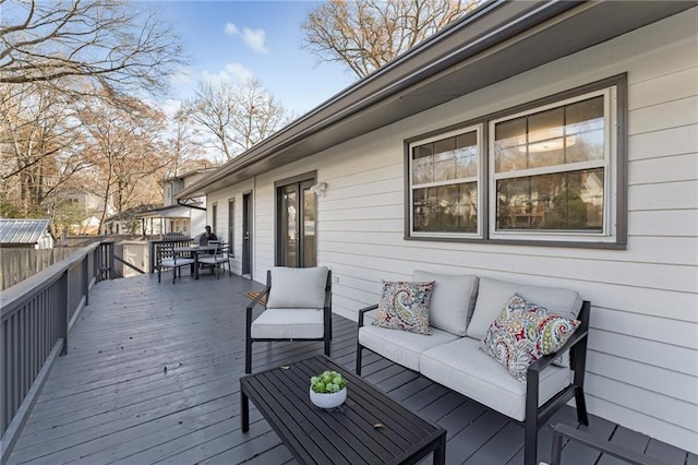 wooden deck featuring an outdoor living space