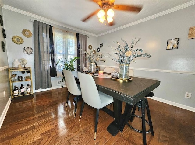 dining room with ceiling fan, ornamental molding, and dark hardwood / wood-style flooring