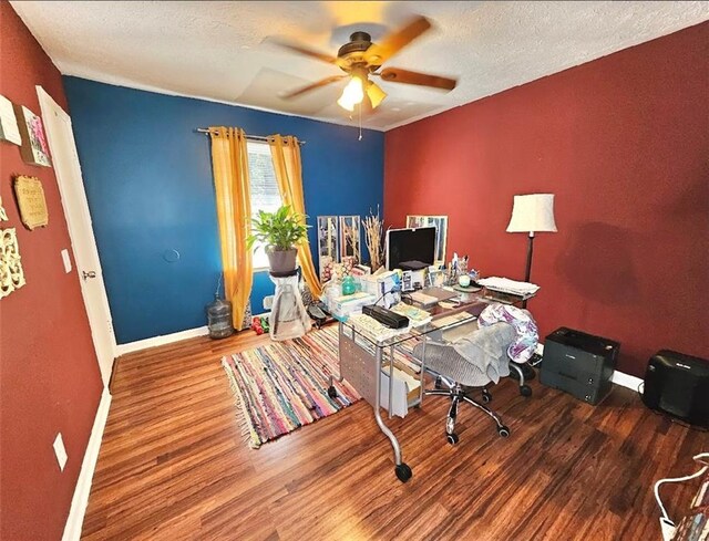 office space with a textured ceiling, ceiling fan, and hardwood / wood-style floors