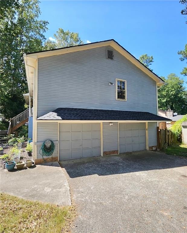 view of property exterior with a garage