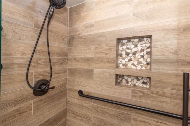 bathroom view of tiled shower
