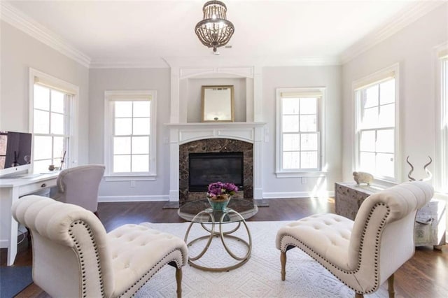 living room featuring plenty of natural light, wood finished floors, and ornamental molding