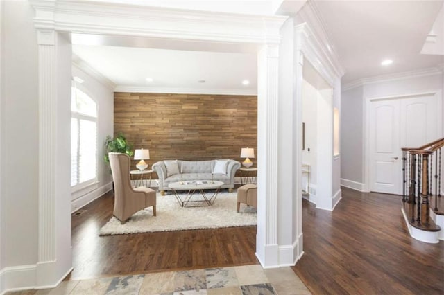sitting room featuring wood finished floors, baseboards, recessed lighting, and crown molding