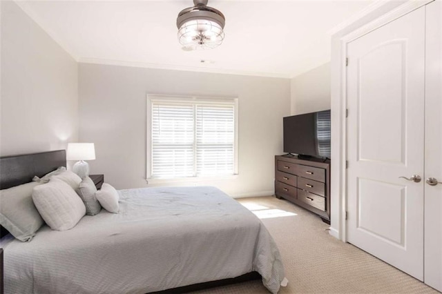 bedroom featuring light carpet and crown molding