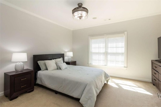 bedroom featuring light colored carpet, crown molding, and baseboards