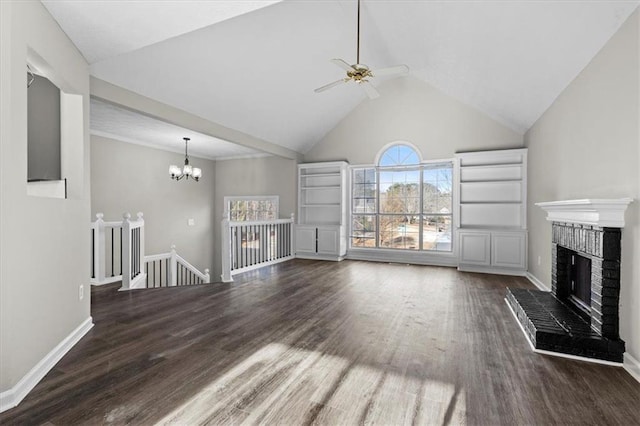 unfurnished living room with high vaulted ceiling, a fireplace, dark hardwood / wood-style flooring, and ceiling fan with notable chandelier