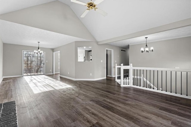 unfurnished living room with lofted ceiling, dark wood-type flooring, and ceiling fan with notable chandelier