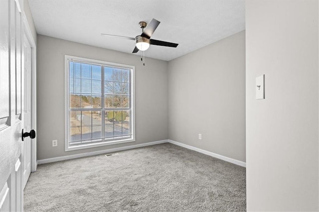 carpeted empty room with ceiling fan