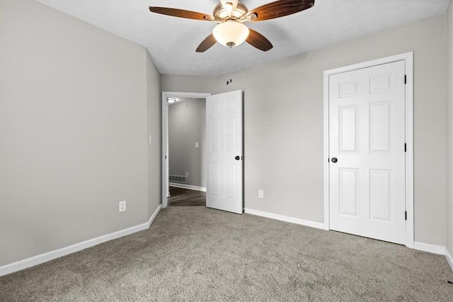 unfurnished bedroom with carpet floors and ceiling fan